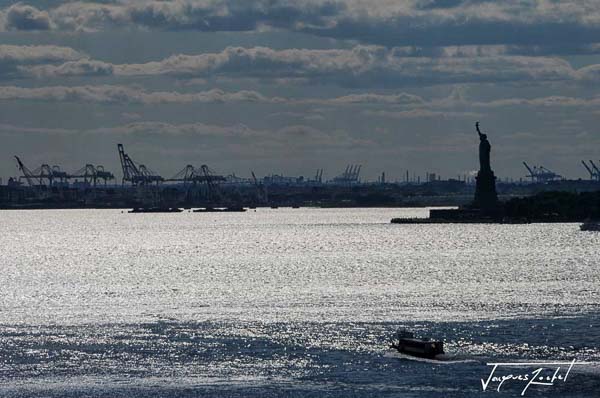 In the bay of New York, the statue of freedom in the distance